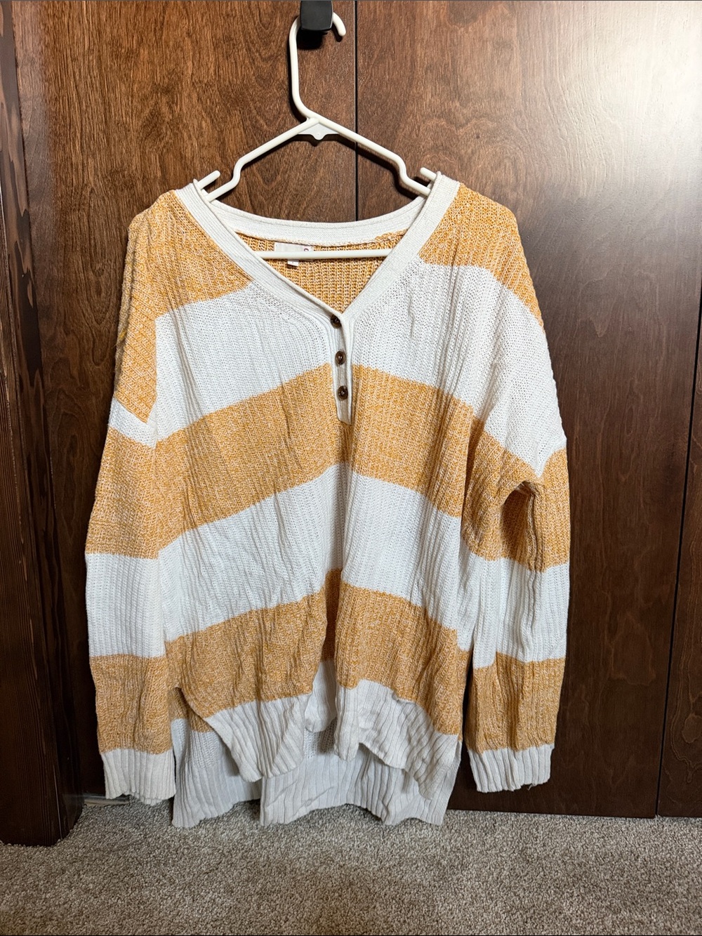 Women’s light orange and white striped sweater